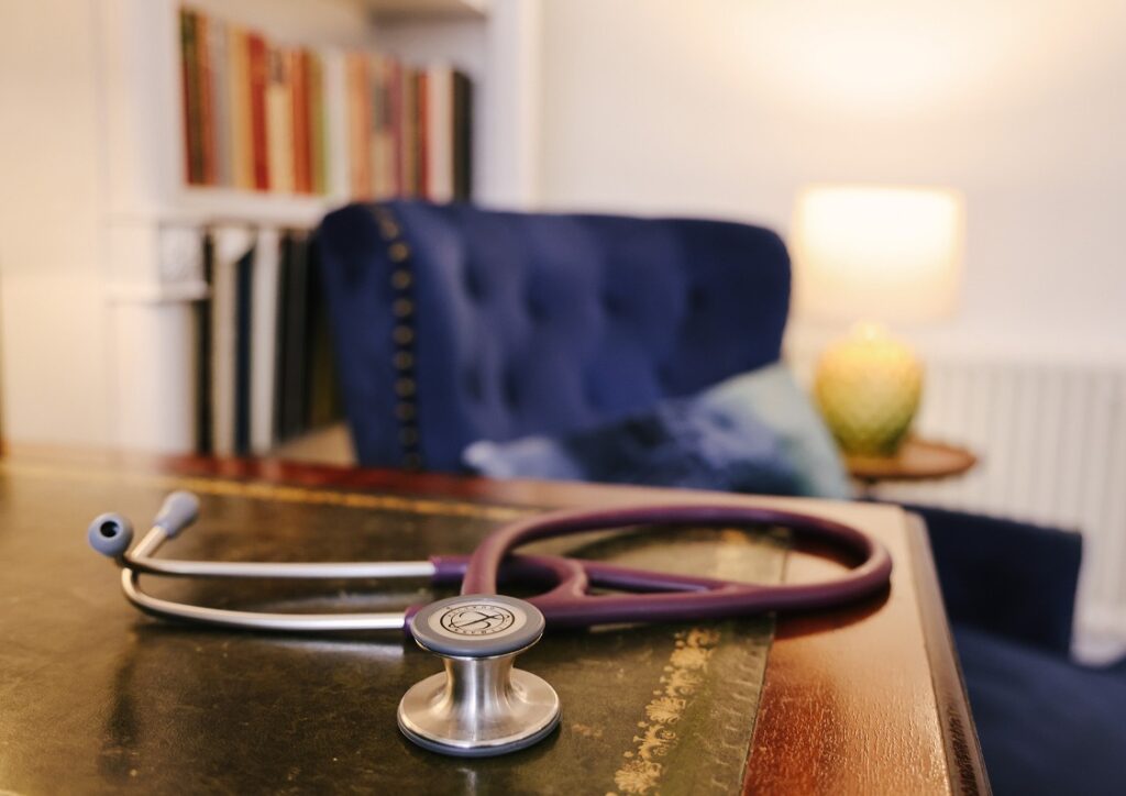 Photo of a stethoscope placed on a desk inside The Duke Practice.